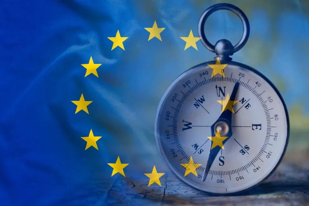 Compass with EU flag background
